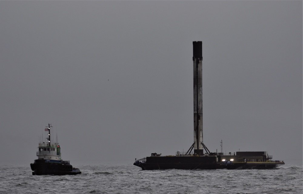 Tug Rachel tows B1046 booster, the first Block 5, to shore
