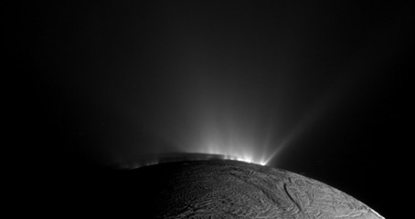Rows of plumes rise from ice fractures on the surface of Enceladus.